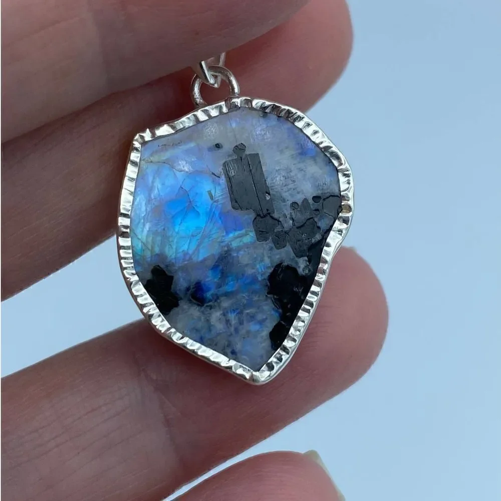 Black Tourmaline In Rainbow Moonstone Slice Sterling Silver Pendant